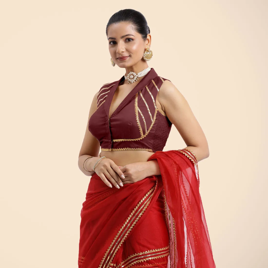 Avni x Tyohaar | Burgundy Sleeveless FlexiFit™ Saree Blouse with Elegant Shawl Collar with Golden Gota Lace Embellishment