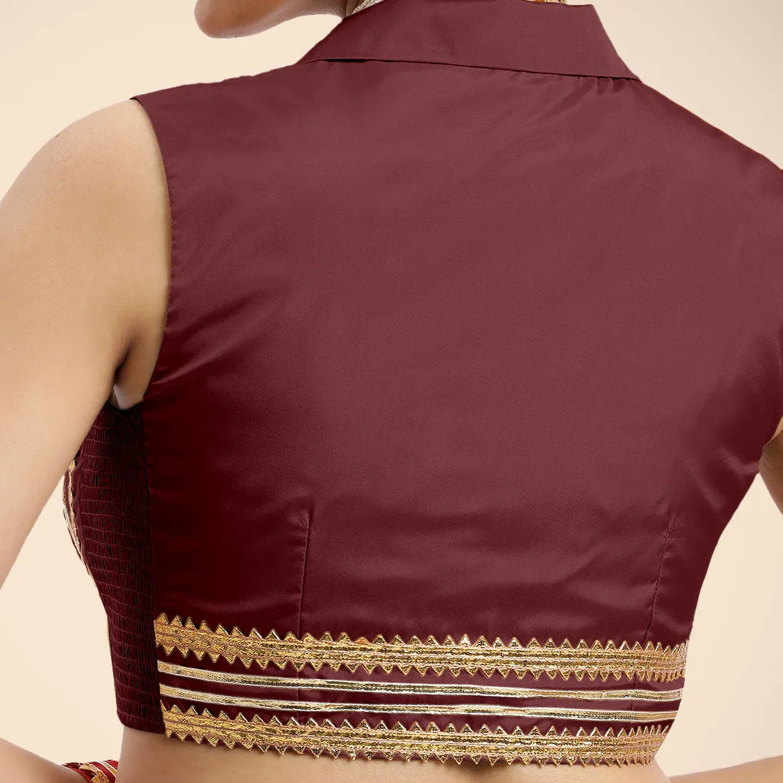 Avni x Tyohaar | Burgundy Sleeveless FlexiFit™ Saree Blouse with Elegant Shawl Collar with Golden Gota Lace Embellishment