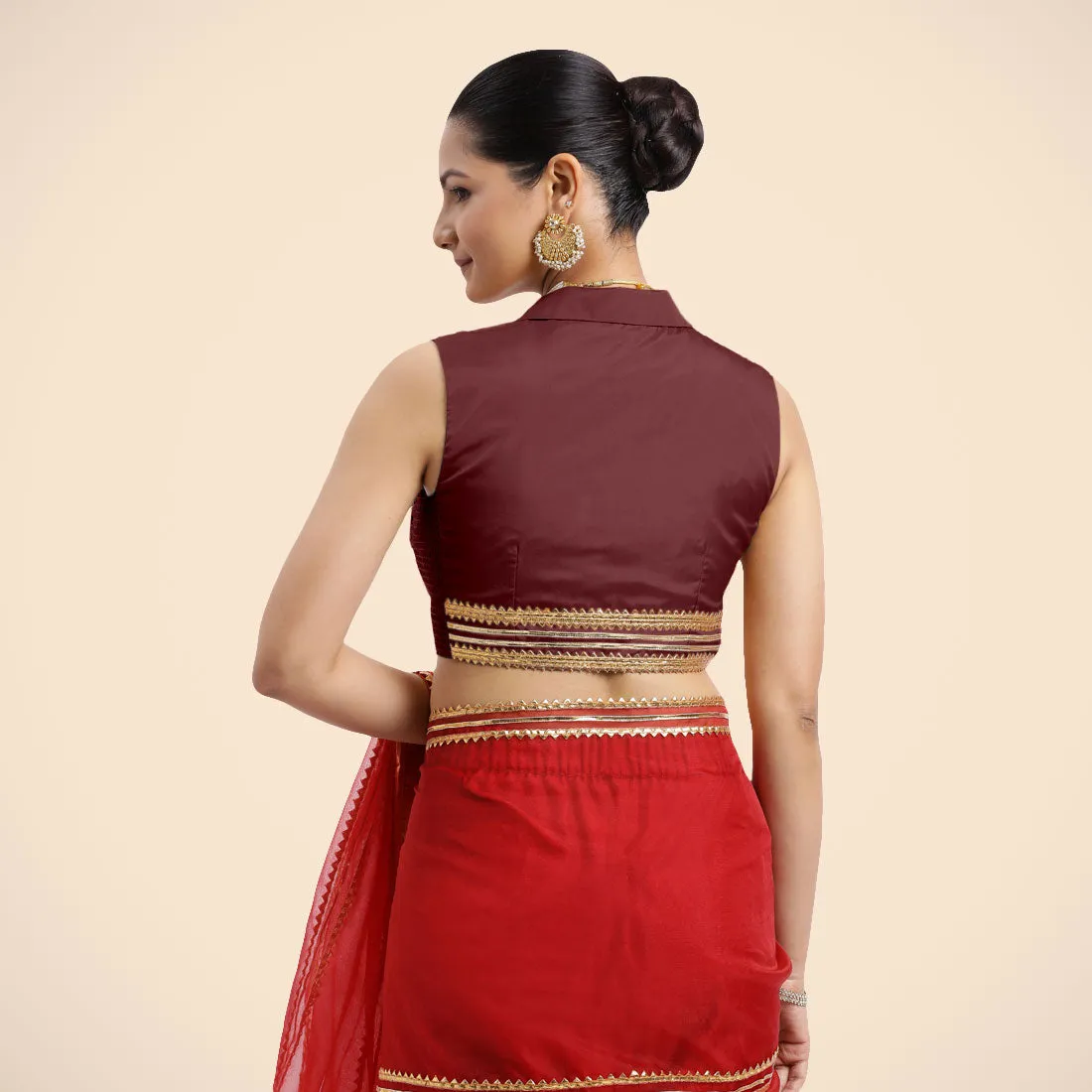 Avni x Tyohaar | Burgundy Sleeveless FlexiFit™ Saree Blouse with Elegant Shawl Collar with Golden Gota Lace Embellishment